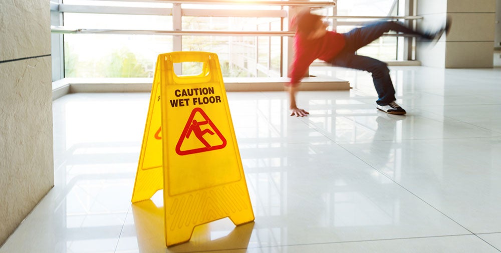 man falling on wet tile