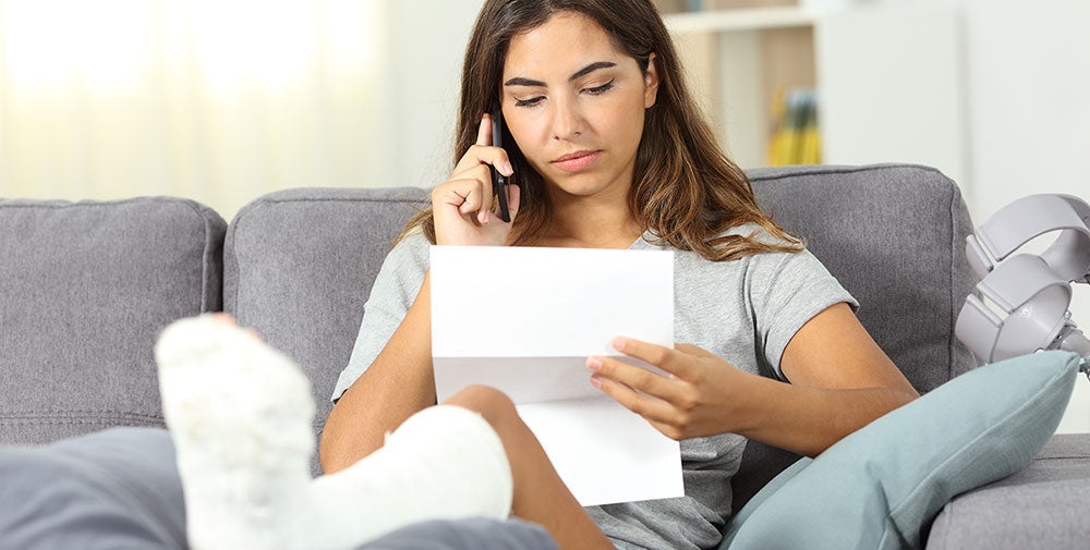 injured woman on couch